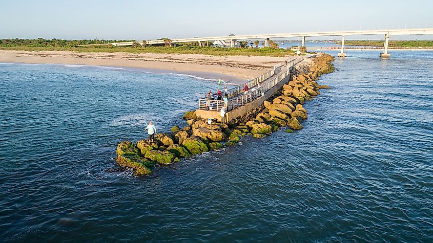 Drone view of the pier at Sebastian Inlet during sunrise, Sebastian, Florida